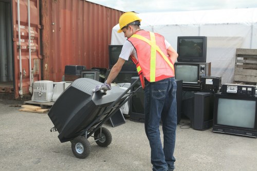 Staff preparing furniture for charity donation